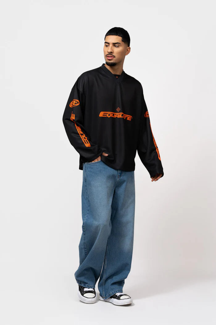 ARENA LONGSLEEVE SHIRT ZWART/ORANJE